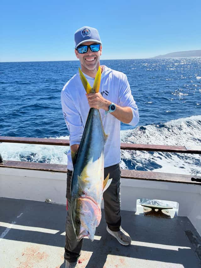 Angler poses with yellowtail and tuna catch — photo 2