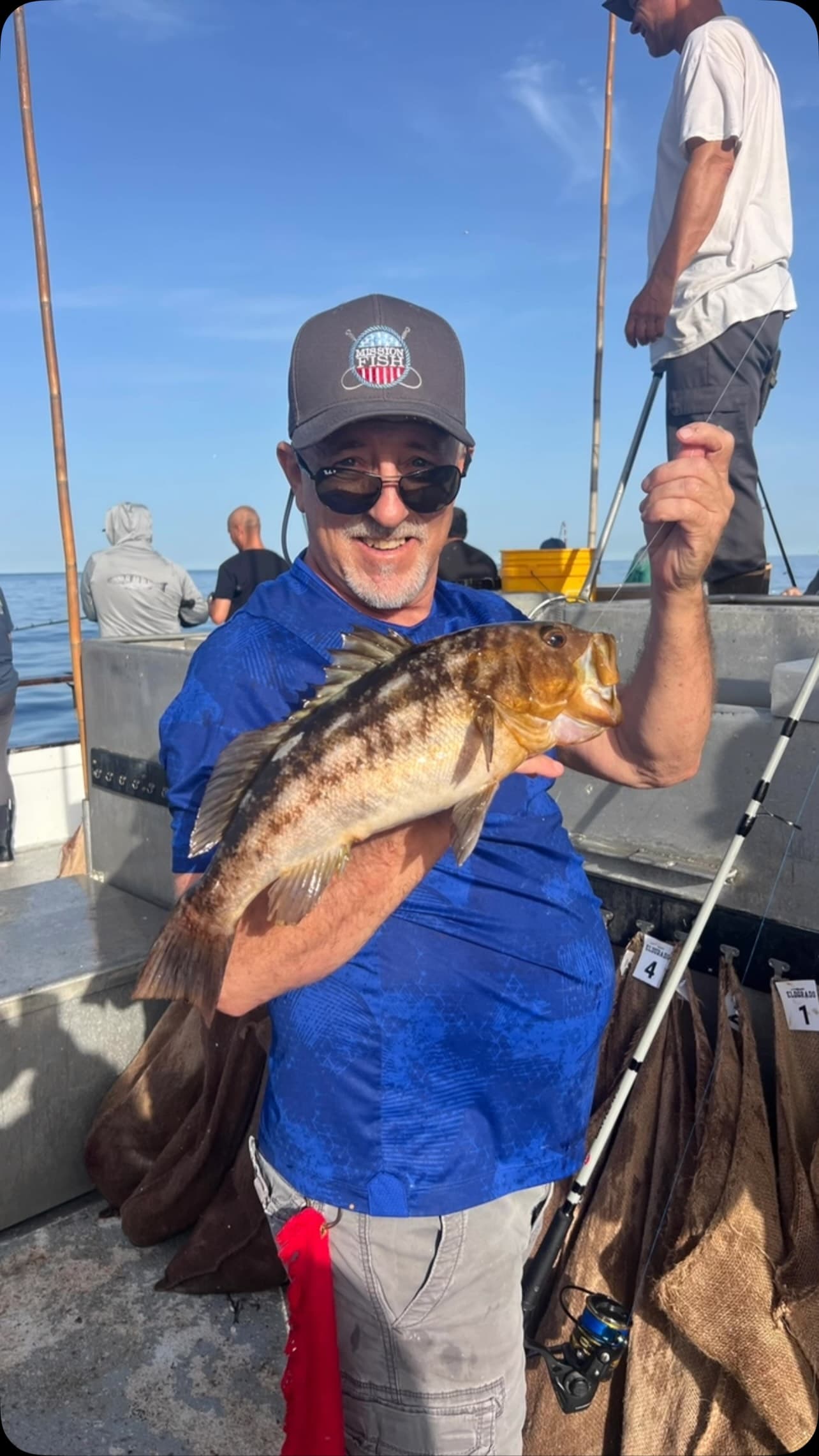Angler shows off a hefty calico bass catch