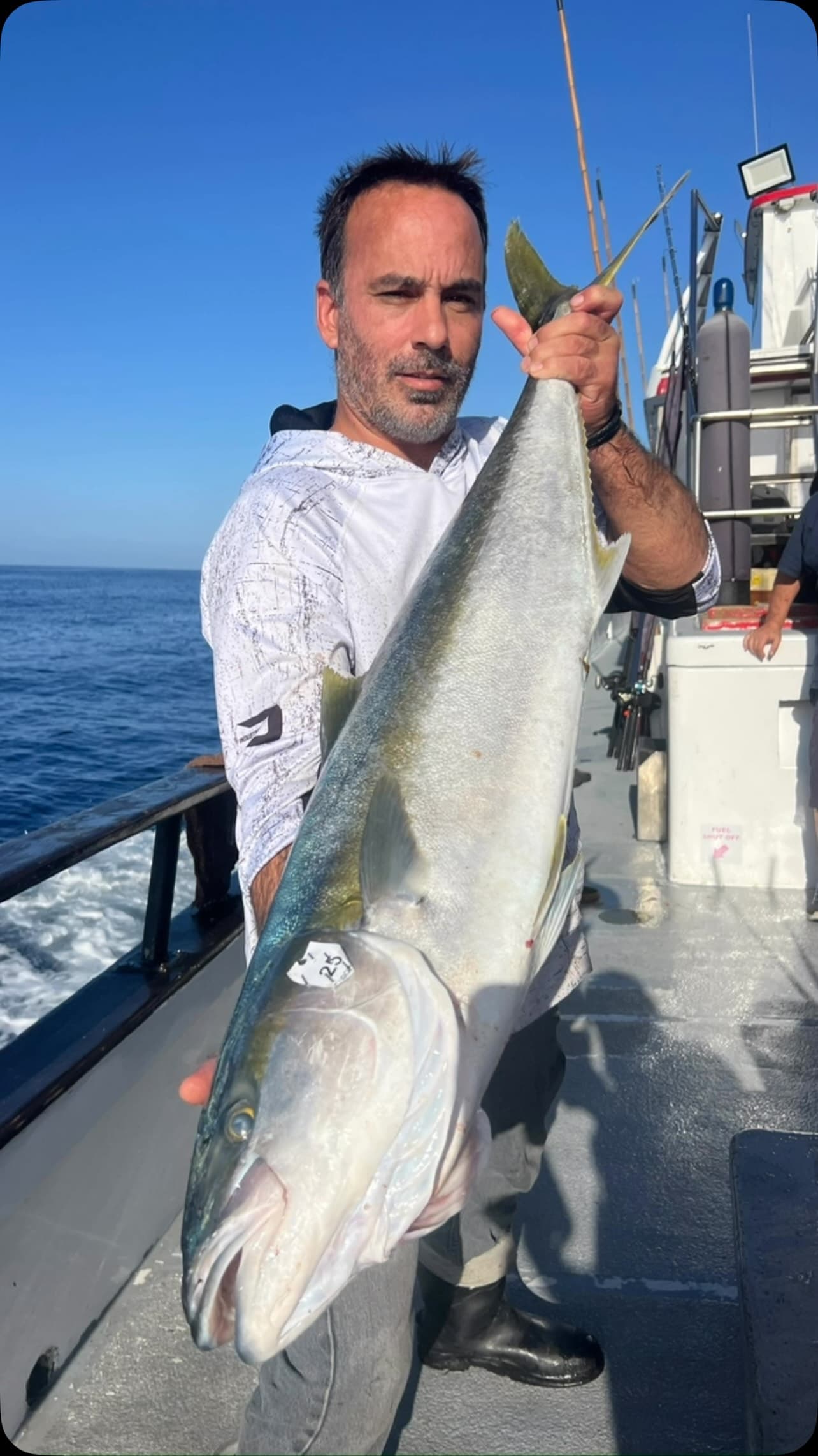 Angler wrestles up a big yellowtail