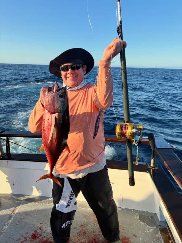 Angler poses with yellowtail and tuna catch — photo 3