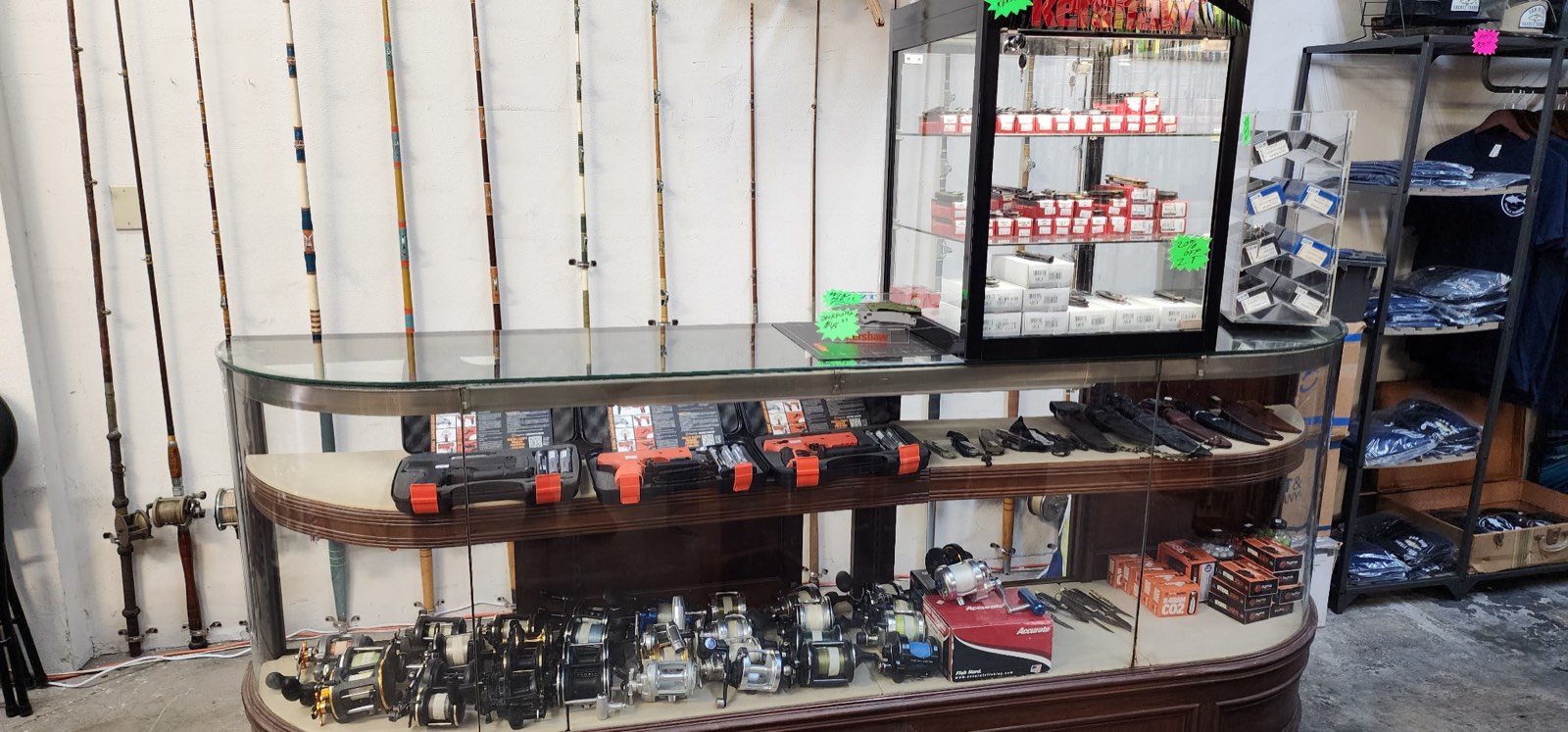 Rod rack wall behind the main showcase of reels and gear