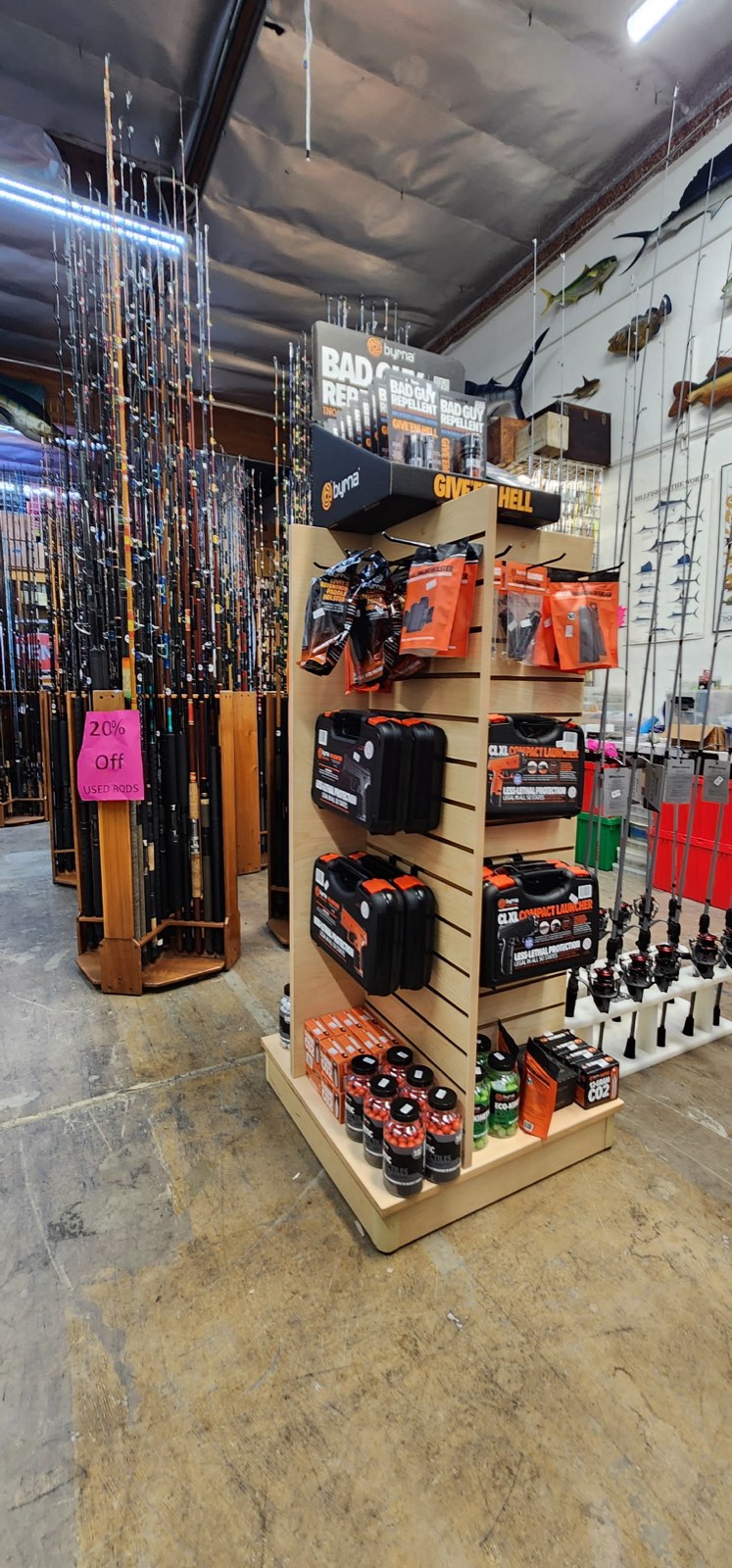 Free-standing tackle display and rod racks on the shop floor